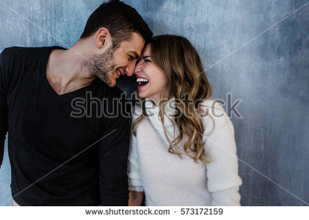 stock-photo-young-couple-in-love-have-fun-i-on-new-years-eve-or-st-valentines-day-573172159.jpg